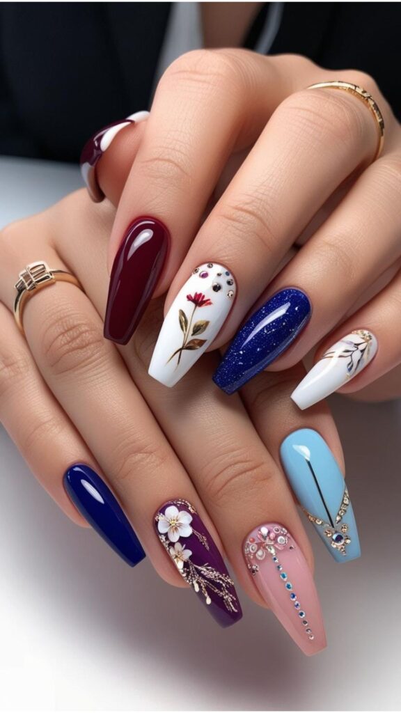 A hand showcasing a variety of nail designs, from simple solid colors to complex patterns and embellishments.