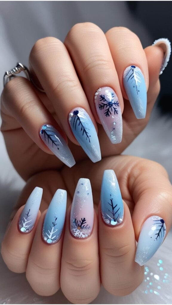 Hands with nail art designs inspired by winter, such as snowflakes, icicles, or winter-themed color palettes.